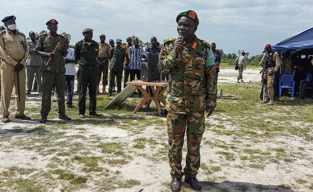 Lt. Gen. Wesley Welebe Samson, Co-Chair of the Joint Transitional Security Committee (JTSC), addresses trainees at Moum military training center in Bentiu, South Sudan Thursday, July 9, 2020. At crowded camps in South Sudan, former enemies are meant to be joining forces and training as a unified security force after a five-year civil war so they can help the shattered country recover but they can barely find enough food. (AP Photo/Maura Ajak)