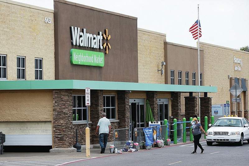 People walk into a Walmart Neighborhood Market store Tuesday, Aug. 4, 2020, in Oklahoma City.