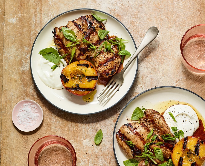 Gingery Grilled Chicken Thighs With Charred Peaches. (The New York Times/Andrew Purcell)