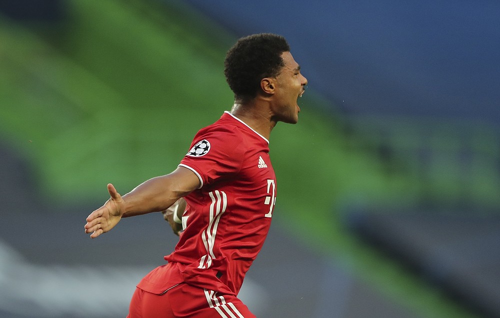 Bayern's Serge Gnabry celebrates after scoring the opening goal of his team during the Champions League semifinal soccer match between Lyon and Bayern Munich at the Jose Alvalade stadium in Lisbon, Portugal, Wednesday, Aug. 19, 2020. (Miguel A. Lopes/Pool via AP)