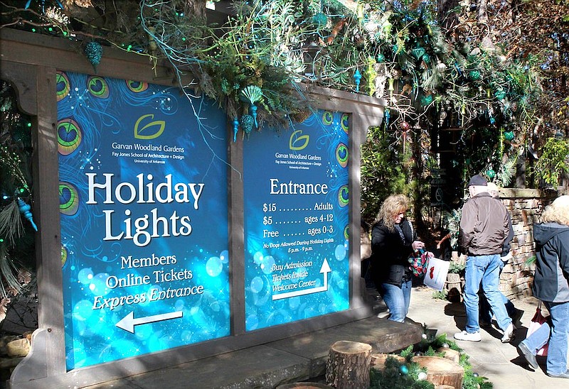 Patrons walk in and out of the Garvan Woodland Gardens entrance during Holiday Lights in 2018. File photo by Richard Rasmussen of The Sentinel-Record