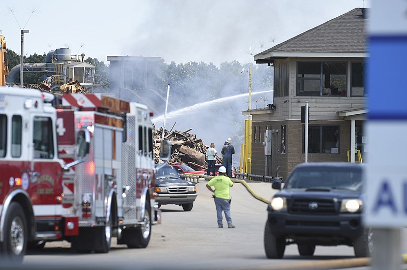 Fire fighters put out a fire, Thursday, August 20, 2020 at the TRG Rogers recycling center in Rogers.(NWA Democrat-Gazette/Charlie Kaijo)