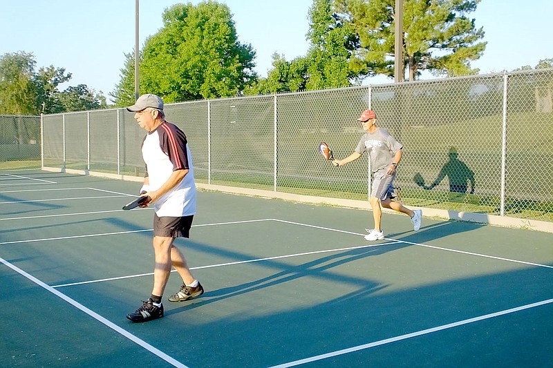 Lynn Atkins/The Weekly Vista
Early on Monday morning, Richard Taylor (front) and Dan Dunn were part of a group of ten who were playing pickleball at the Metfield Park. There are three courts built for pickleball at the park.