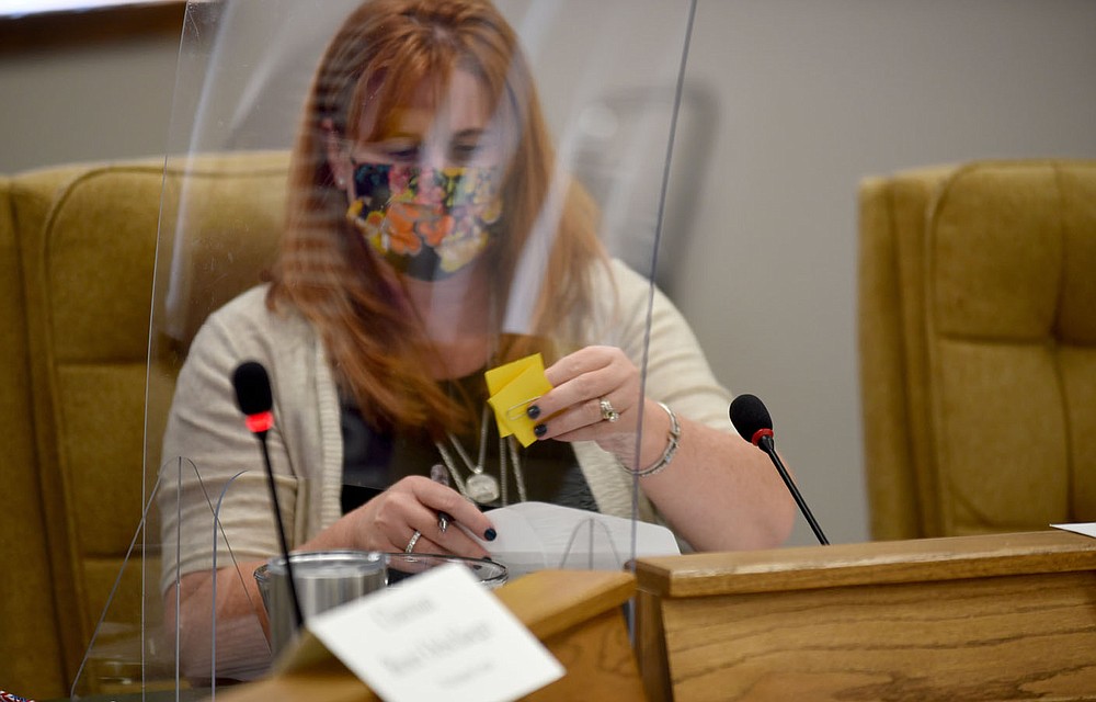 Jennifer Price, Director of Elections with the Washington County Election Commission, places numbers in a bowl for the drawing of ballot positions Friday, August 21, 2020, for a candidate on the November 3 General Election at the Washington County Courthouse. Ballot positions were drawn for Federal, State, County and Municipal races. Check out nwaonline.com/200822Daily/ and nwadg.com/photos for a photo gallery.
(NWA Democrat-Gazette/David Gottschalk)