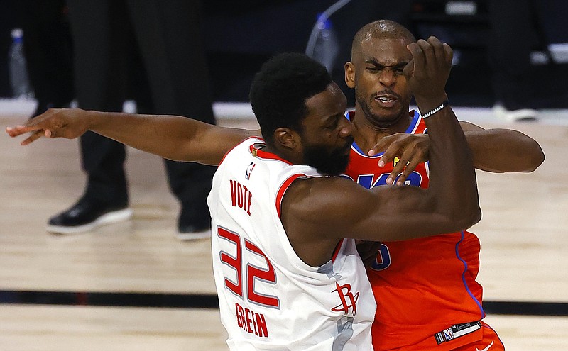 Oklahoma City Thunder's Chris Paul, right, tangles with Houston Rockets' Jeff Green during the third quarter of Game 3 of an NBA basketball first-round playoff series, Saturday, Aug. 22, 2020, in Lake Buena Vista, Fla. (Mike Ehrmann/Pool Photo via AP)
