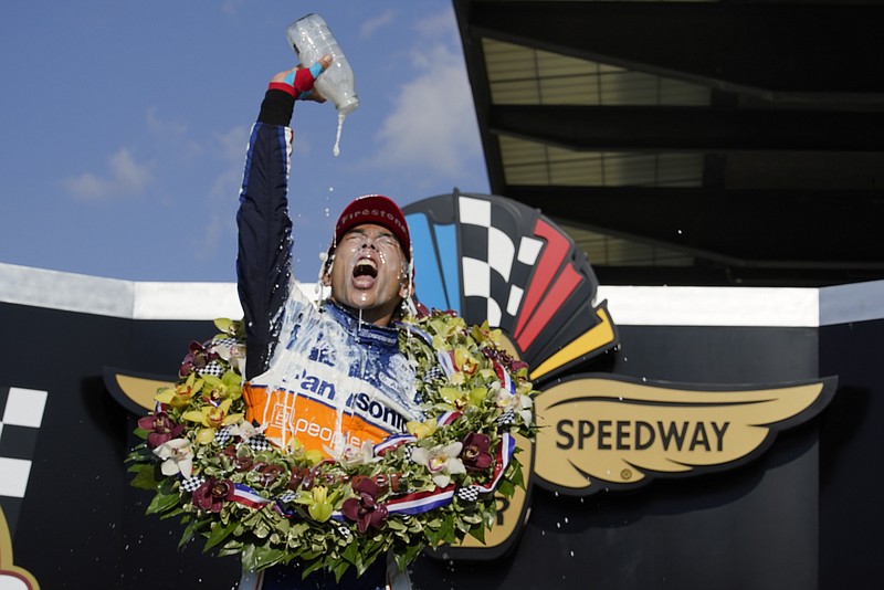 Takuma Sato, of Japan, celebrates after winning the Indianapolis 500 auto race at Indianapolis Motor Speedway, Sunday, Aug. 23, 2020, in Indianapolis. (AP Photo/Michael Conroy)