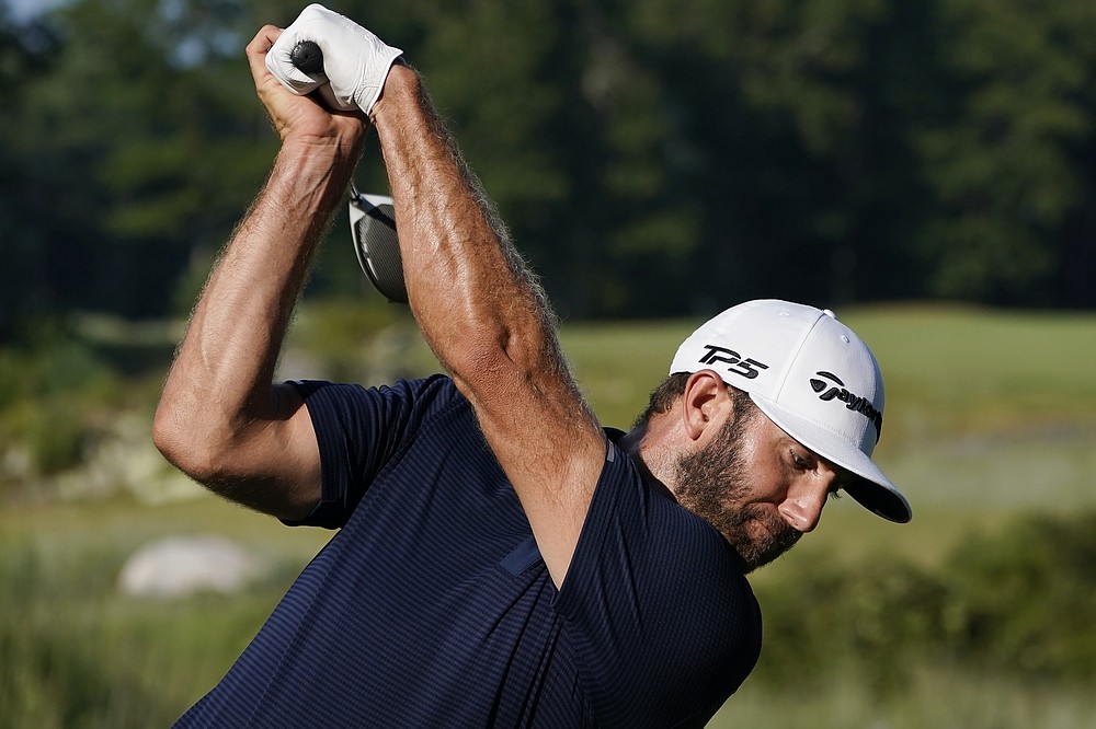 Dustin Johnson tees off on the 13th hole during the final round of the Northern Trust golf tournament at TPC Boston, Sunday, Aug. 23, 2020, in Norton, Mass. (AP Photo/Charles Krupa)