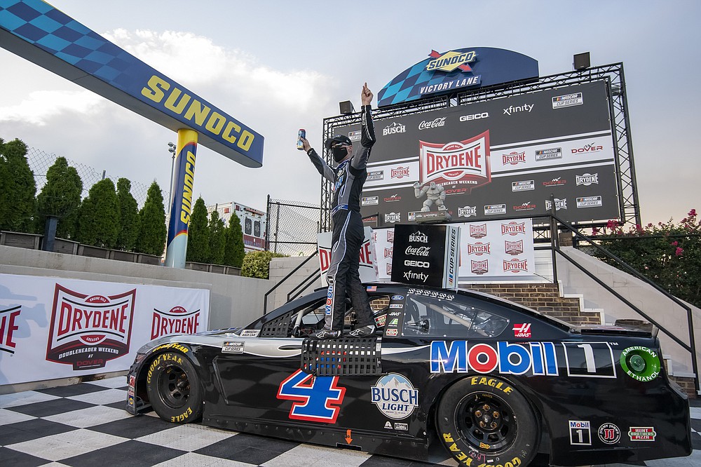 Kevin Harvick (4) celebrates after winning a NASCAR Cup Series auto race at Dover International Speedway, Sunday, Aug. 23, 2020, in Dover, Del. (AP Photo/Jason Minto)