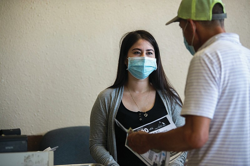 Jenny Canchola, owner of Las Delicias, talks with a customer about taking the census as they check out at her store on Friday, Aug. 21, 2020. North Little Rock is starting up a new census campaign after city officials said the response rates are lagging behind many cities.

(Arkansas Democrat-Gazette / Stephen Swofford)