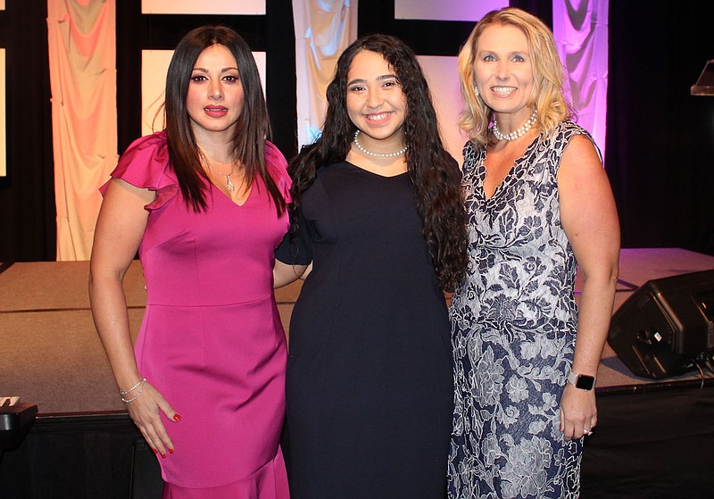 NWA Democrat-Gazette/CARIN SCHOPPMEYER Silvia Azrai Kawas (from left), Youth of the Year Shakira H. and Melody Richard stand for a photo at the Boys and Girls Club of Benton County Youth of the Year celebration March 28 at the John Q. Hammons Center in Rogers.