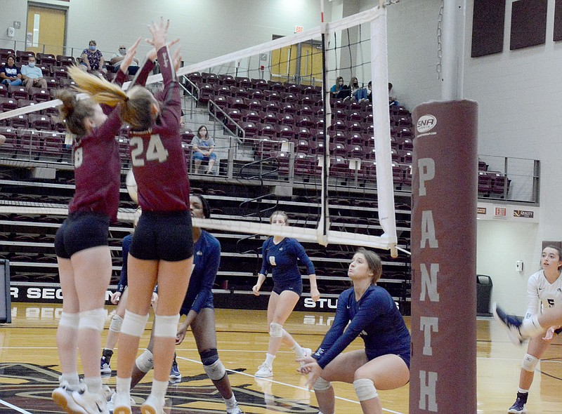 Graham Thomas/Siloam Sunday
Siloam Springs volleyball players Emma Norberg, No. 8, and Cailee Johnson go up for a block at the net against Bentonville West on Tuesday in the Lady Panthers' season opener at Panther Activity Center. West won the match 3-0.