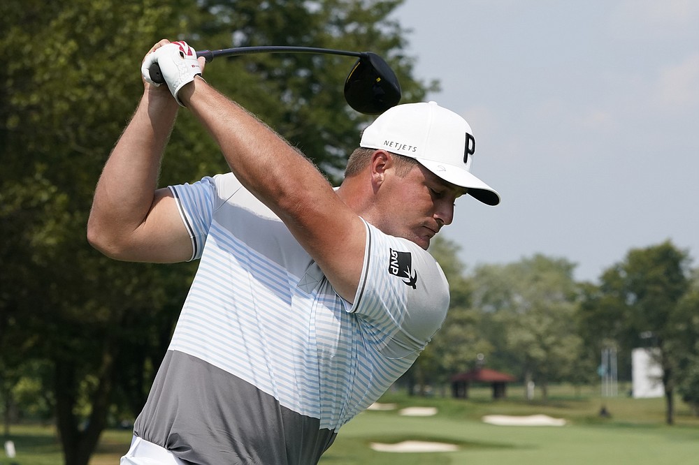 Bryson DeChambeau swings on his tee shot during a practice round Wednesday, Aug. 26, 2020, for the BMW Championship golf tournament at the Olympia Fields Country Club in Olympia Fields, Ill. (AP Photo/Charles Rex Arbogast)