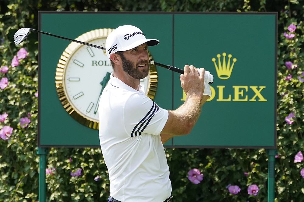 Dustin Johnson watches his tee shot during a practice round Wednesday, Aug. 26, 2020, for the BMW Championship golf tournament at the Olympia Fields Country Club in Olympia Fields, Ill. (AP Photo/Charles Rex Arbogast)