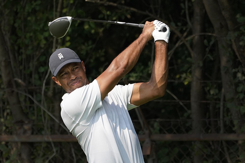 Tiger Woods watches his tee shot during a practice round Wednesday, Aug. 26, 2020, for the BMW Championship golf tournament at the Olympia Fields Country Club in Olympia Fields, Ill. (AP Photo/Charles Rex Arbogast)