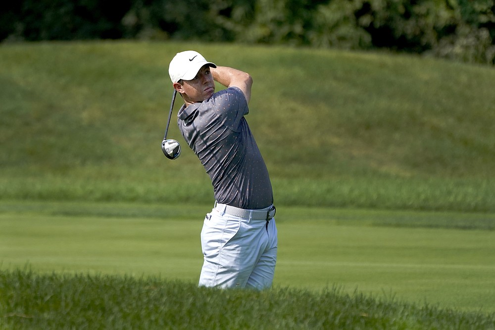 Rory McIlroy watches his tee approach shot during a practice round Wednesday, Aug. 26, 2020, for the BMW Championship golf tournament at the Olympia Fields Country Club in Olympia Fields, Ill. (AP Photo/Charles Rex Arbogast)