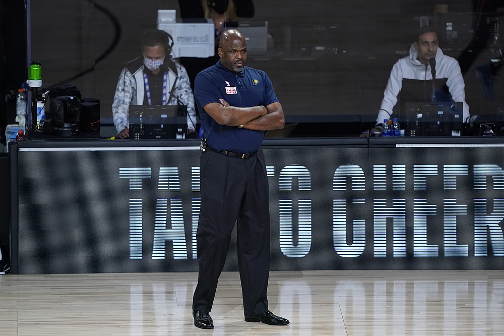 Indiana Pacers head coach Nate McMillan watches during the first half of an NBA basketball first round playoff game against the Miami Heat, Tuesday, Aug. 18, 2020, in Lake Buena Vista, Fla. (AP Photo/Ashley Landis, Pool)