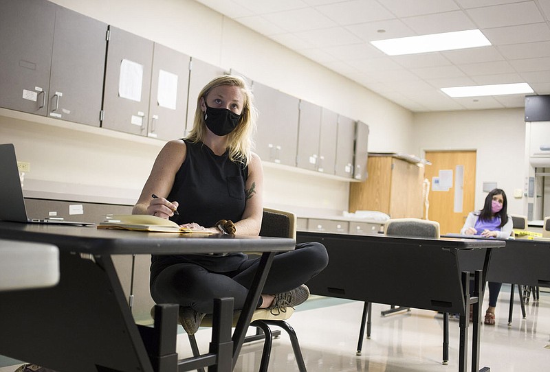 Haleigh Smith listens to a lecture, Thursday, August 27, 2020 during an anatomy and physiology class at the Northwest Arkansas Community College in Bentonville. Check out nwaonline.com/200828Daily/ for today's photo gallery. 
(NWA Democrat-Gazette/Charlie Kaijo)