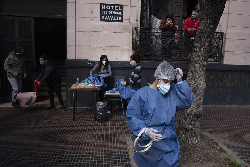 Healthcare workers from the University of Buenos Aires prepare to conduct covid-19 tests in Buenos Aires, Argentina, on Aug. 19, 2020. MUST CREDIT. Bloomberg photo by Pablo E. Piovano.