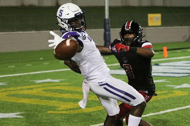 Central Arkansas' Lajuan Winningham (5) reaches for the ball in front of Austin Peay defensive back Isaiah Norman on Saturday during the Bears' 24-17 victory over the Governors in Montgomery, Ala. Winningham caught a 10-yard touchdown pass from Breylin Smith with 34 seconds remaining to give the Bears the victory. - Photo courtesy of University of Central Arkansas