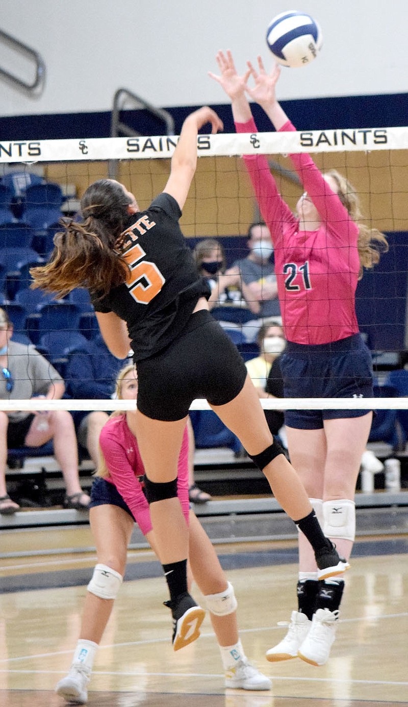 Westside Eagle Observer/MIKE ECKELS
Lauren Irwin (Gravette 5) spikes the ball pass Rylee Kallesen (Shiloh 21) and deep into Lady Saints territory for a Lady Lions point during the Shiloh Christian-Gravette volleyball match in Springdale September 3. The Lady Saints took the match in three sets 25-13, 25-11, 26-16. story.lead_photo.caption