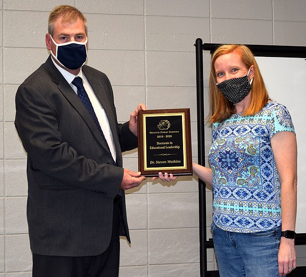 Watkins receives award during Decatur School Board meeting