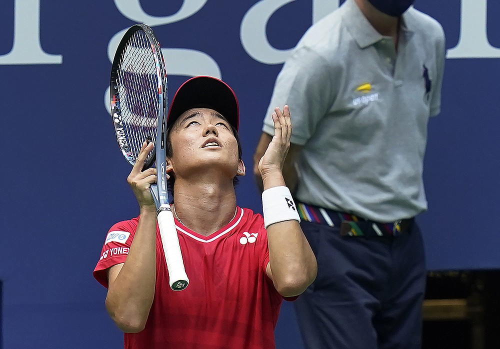 Yoshihito Nishioka, of Japan, reacts after losing a point to Andy Murray, of Great Britain, during the first round of the US Open tennis championships, Tuesday, Sept. 1, 2020, in New York. (AP Photo/Seth Wenig)