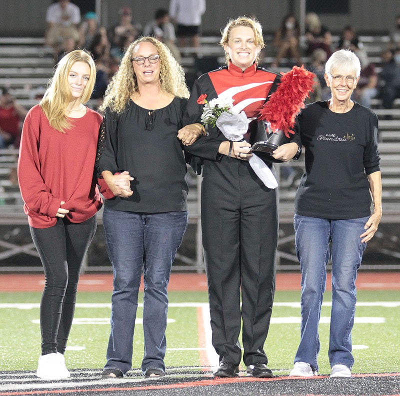 Band senior Jeremiah Wachtel, escorted by mother and grandmother, Stephanie and Brenda Kotouc, and father Jeremy Wachtel