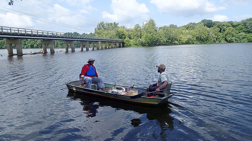 Nick Wright (left) and Alvin English, both of Fayetteville, head out to catch crappie and bluegill on Aug. 3 2020 at Lake Sequoyah.
(NWA Democrat-Gazette/Flip Putthoff)