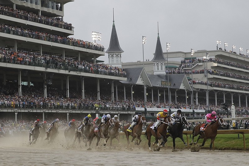 FILE - In this Saturday, May 4, 2019 file photo, Flavien Prat on Country House, third from right, races against Luis Saez on Maximum Security, right, during the 145th running of the Kentucky Derby horse race at Churchill Downs in Louisville, Ky. Maximum Security finished first but was disqualified. The fastest two minutes in sports will also be the quietest in Kentucky Derby history. Churchill Downs scraped plans earlier this month for 23,000 physically distanced, masked fans to attend Saturday's rescheduled Tripled Crown race due to the rise in coronavirus cases. It will be the first time spectators will not be allowed to attend the race.(AP Photo/Darron Cummings, File) story.lead_photo.caption