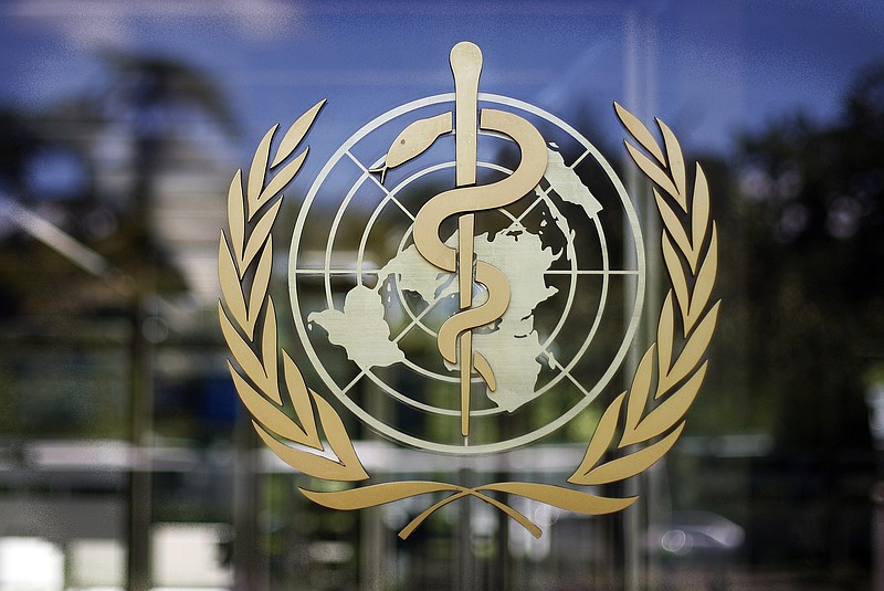 FILE - In this Thursday, June 11, 2009 file photo, the logo of the World Health Organization is seen at the WHO headquarters in Geneva, Switzerland. An independent panel appointed by the World Health Organization to review the U.N. health agency’s coordination of the response to the COVID-19 pandemic said on Thursday, Sept. 3, 2020 it would have full access to any internal U.N. agency documents, materials and emails necessary as the group begins their probe. (AP Photo/Anja Niedringhaus, file)