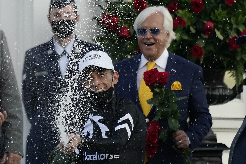 John Velazquez celebrates after riding Authentic to victory in the 146th running of the Kentucky Derby at Churchill Downs, Saturday, Sept. 5, 2020, in Louisville, Ky. (AP Photo/Jeff Roberson)