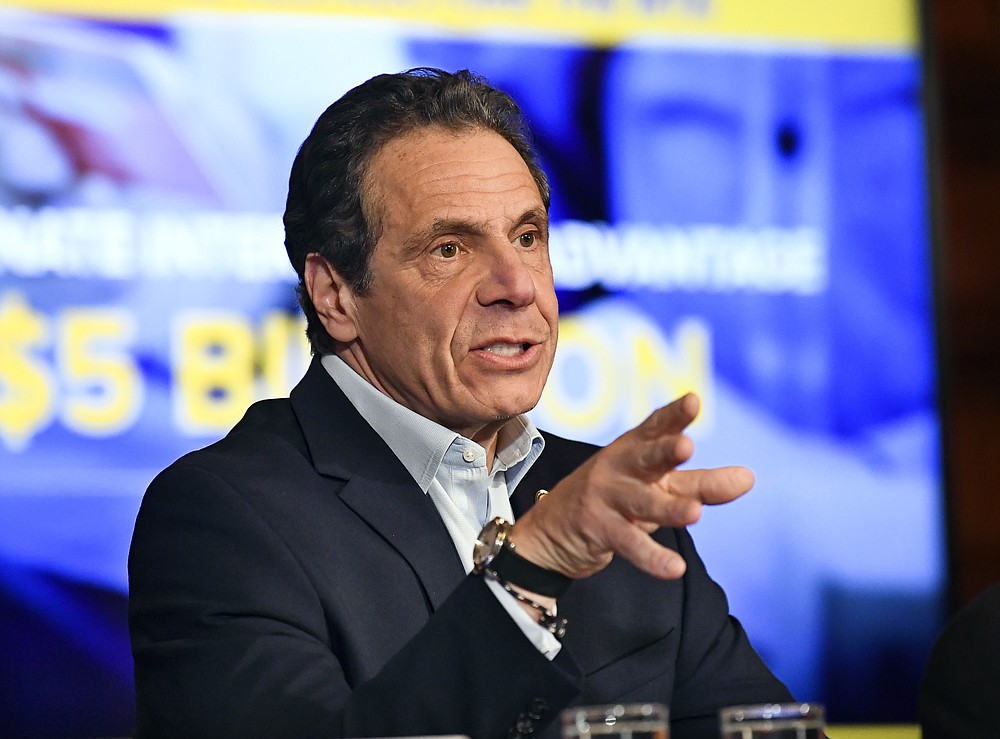 FILE - In this March 31, 2020 file photo, New York Gov. Andrew Cuomo speaks about the $175.5 billion state budget during a news conference in the Red Room at the state Capitol in Albany, N.Y. Spending cuts are compounding for schools and state programs, reserve funds are dwindling, and some governors have begun proposing new taxes and fees to shore up state finances shaken by the coronavirus pandemic. With Congress deadlocked over a new coronavirus relief package, many states haven't had the luxury of waiting to see whether more federal money will come their way. (AP Photo/Hans Pennink, File)