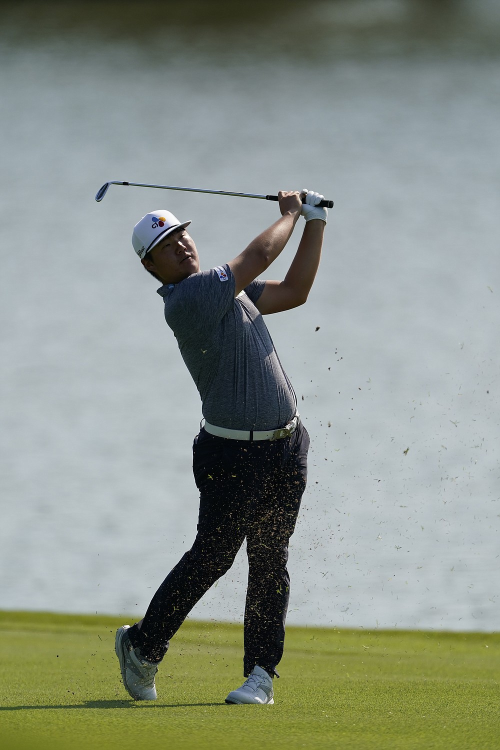Sungjae Im hits from the fairway on the 8th hole during the third round of the Tour Championship golf tournament at East Lake Golf Club in Atlanta, Sunday, Sept. 6, 2020. (AP Photo/John Bazemore)