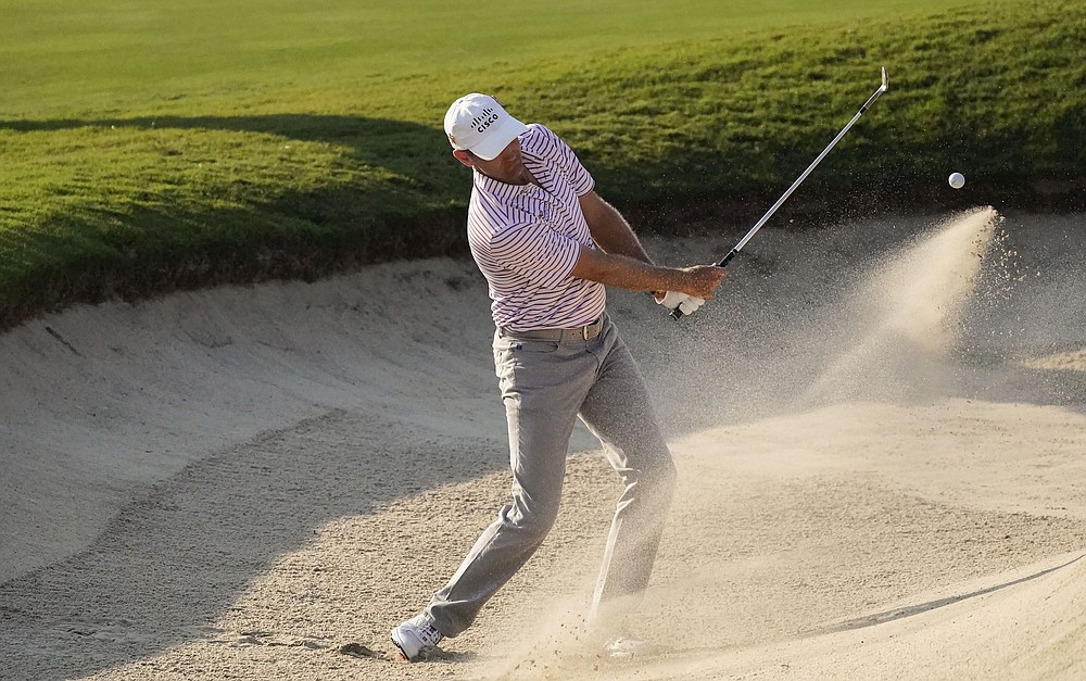 Brendon Todd hits from the bunker on the 18th hole during the third round of the Tour Championship golf tournament at East Lake Golf Club in Atlanta, Sunday, Sept. 6, 2020. (AP Photo/John Bazemore)