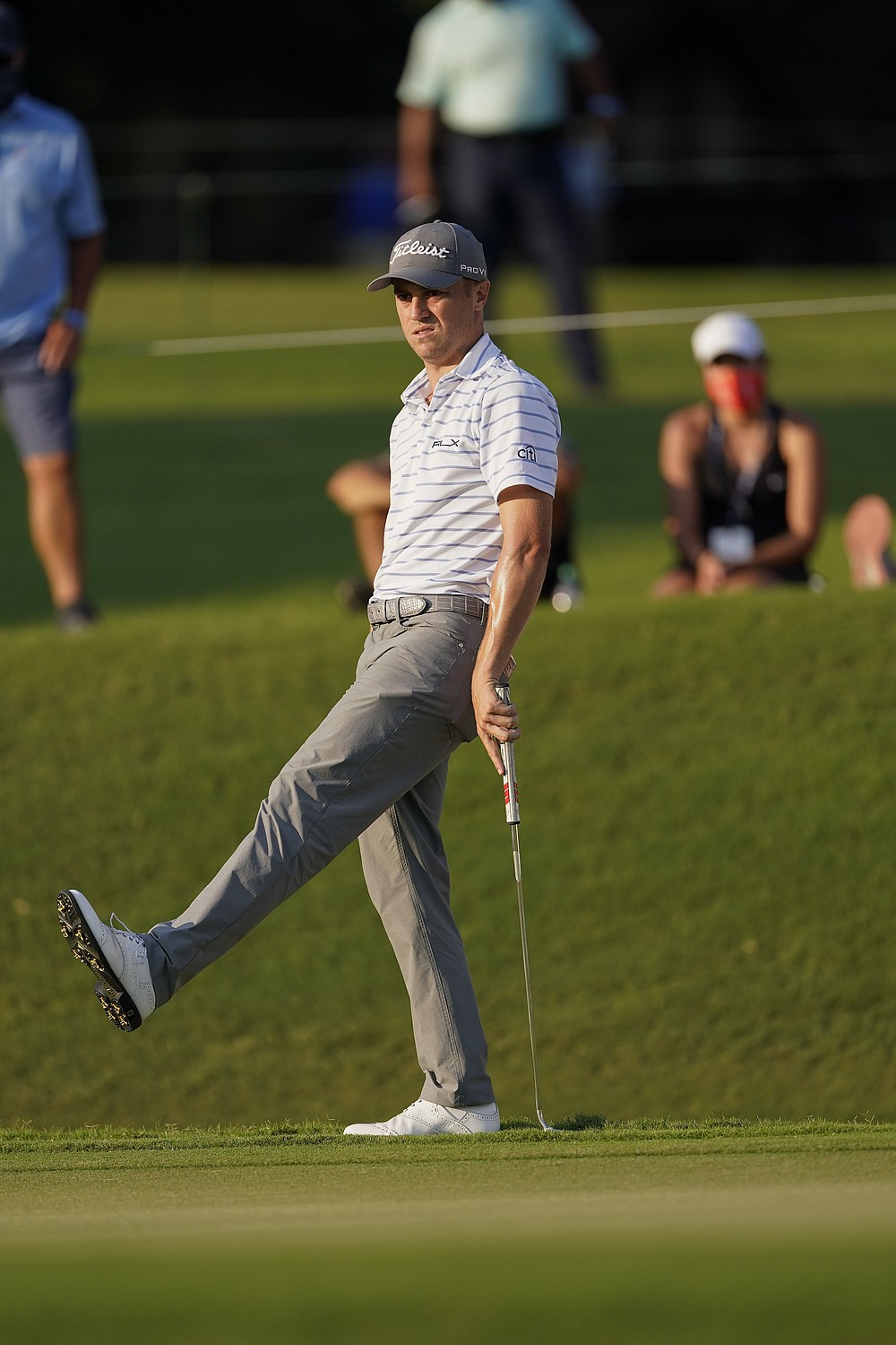 Justin Thomas reacts after missing a birdie putt on the 18th hole during the third round of the Tour Championship golf tournament at East Lake Golf Club in Atlanta, Sunday, Sept. 6, 2020. (AP Photo/John Bazemore)