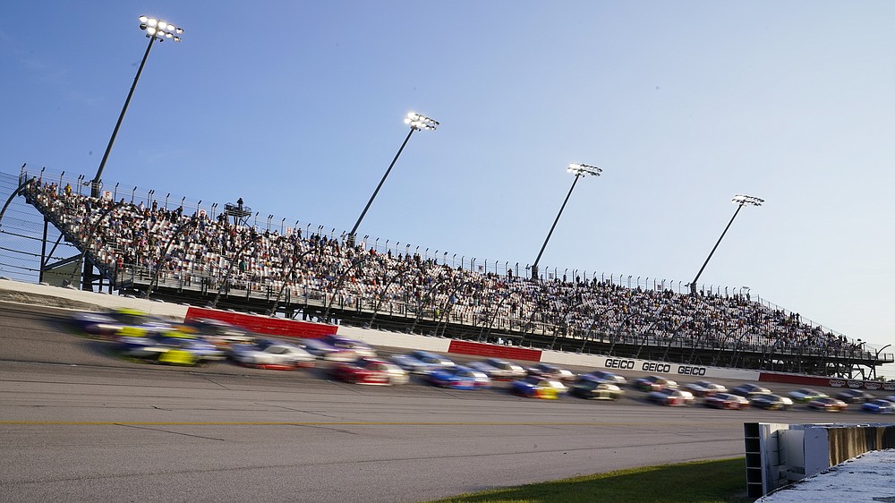 Cars run through Turn 2 during a NASCAR Cup Series auto race Sunday, Sept. 6, 2020, in Darlington, S.C. (AP Photo/Chris Carlson)