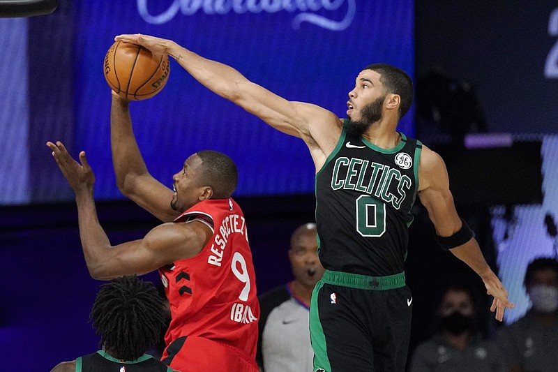 Boston Celtics' Jayson Tatum (0) blocks the shot of Toronto Raptors' Serge Ibaka (9) during the second half of an NBA conference semifinal playoff basketball game Monday, Sept. 7, 2020, in Lake Buena Vista, Fla. (AP Photo/Mark J. Terrill)