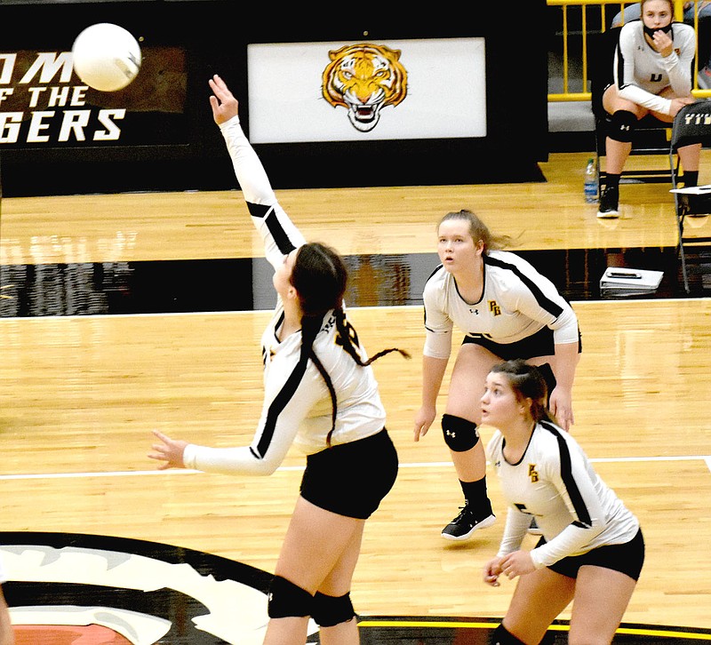 MARK HUMPHREY  ENTERPRISE-LEADER/Prairie Grove senior Kennedy Conrad plays the ball over the net. Conrad contributed 7 kills during a conference win over Gravette on Sept. 24.