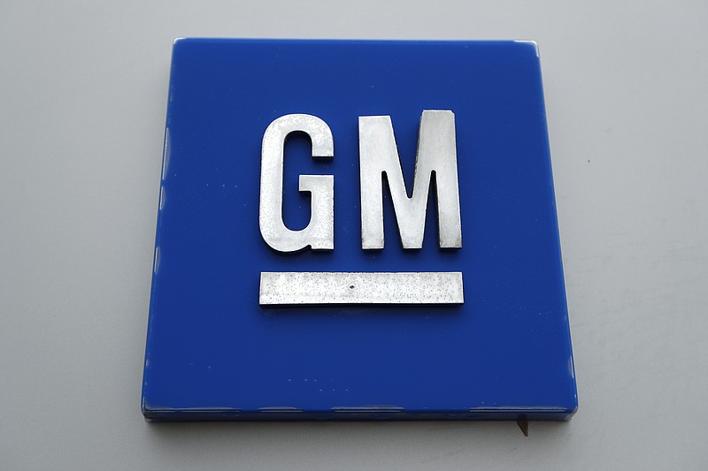 FILE - This Jan. 27, 2020, file photo shows a General Motors logo at the General Motors Detroit-Hamtramck Assembly plant in Hamtramck, Mich. General Motors is taking a $2 billion equity stake in Nikola that will see it engineer and make the company's Badger, a fully-electric and hydrogen fuel cell electric pickup truck.  (AP Photo/Paul Sancya, File)