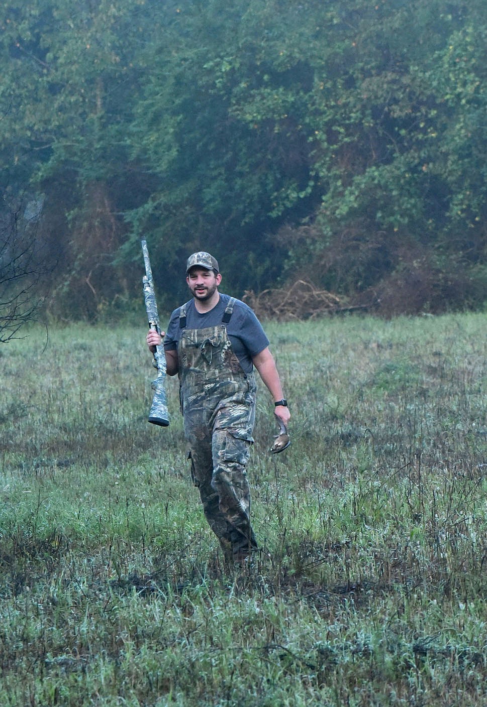 Matt Hughes brings a dove back to his hunting spot.
(NWA Democrat-Gazette/Flip Putthoff)
