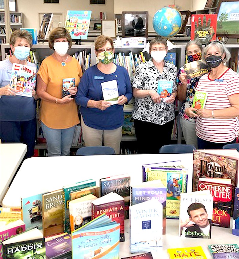 Westside Eagle Observer/SUBMITTED
These new books were donated by Altrusa International of Bentonville/Bella Vista to Decatur's Iva Jane Peek Public Library in recognition of International Literacy Day on Sept. 8. On hand for the ceremony were Gail Cowdin (left), Terri Gaither, Marian Eagle, Library Director Karen Jones, Karen McCauley and Gay Kiker.