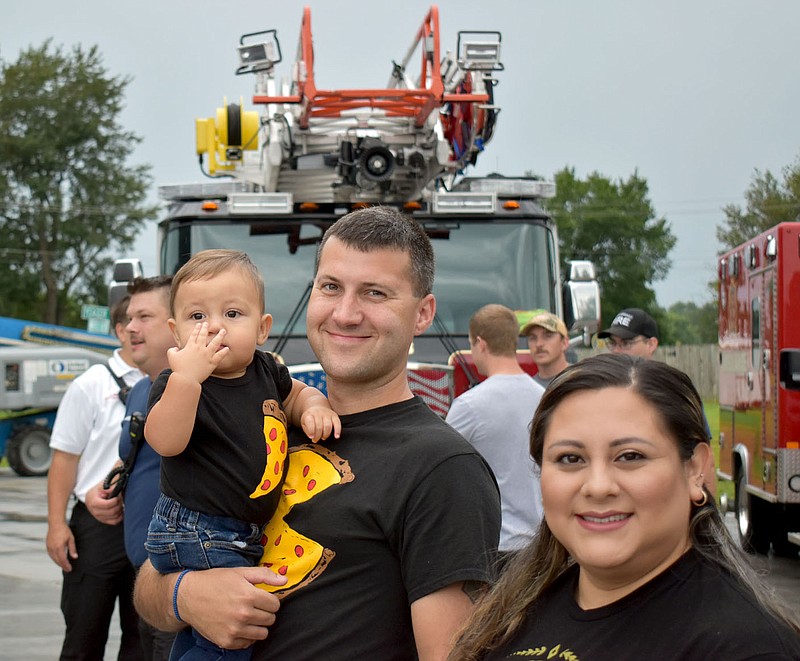 Heidi Duhacheck/Special to the Herald-Leader
Ethan Griggs (left) attends a Siloam Springs Fire Department event last year with his parents Captain Zach Griggs and Jennifer Griggs. Ethan is in need of a kidney transplant and his dad is a match.