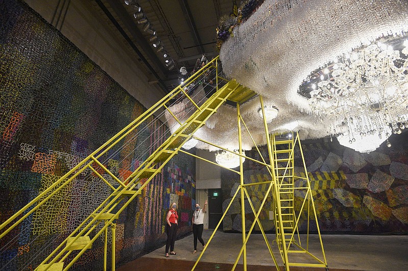 Robin Groesbeck (left) and Jessi Mueller look at the exhibit "Crystal Cloudscape" Thursday at The Momentary in Bentonville. The Momentary is presenting its new exhibit "Nick Cave: Until, organized by MASS MoCA," open from Saturday to Jan. 3, 2021. The free immersive exhibition spans over 24,000 square feet and serves is a response to the question, "is there racism in heaven?" Check out nwaonline.com/200911Daily/ for today's photo gallery. 
(NWA Democrat-Gazette/Charlie Kaijo)