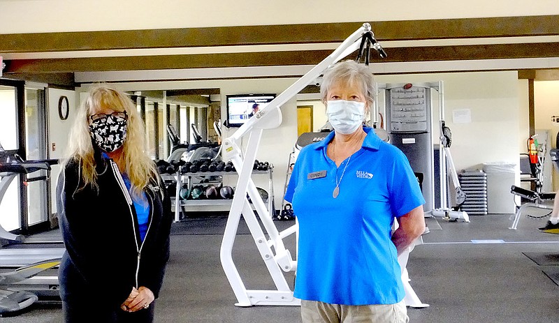 Lynn Atkins/The Weekly Vista
Lisa Elliott and Cindy Bladow are welcoming members back to the Metfield Fitness Center which recently reopened. Because of covid-19, there are some new guidelines in place. Members must wear a facemask unless they are actively exercising. Only eight members at one time are allowed, so one hour appointments are needed. There are no classes at Metfield, but classes have restarted at the Riordan location. The center is open Monday throughThursday, 7 a.m. to 8 p.m., Friday and Saturday, 7 a.m. to 1 p.m.
