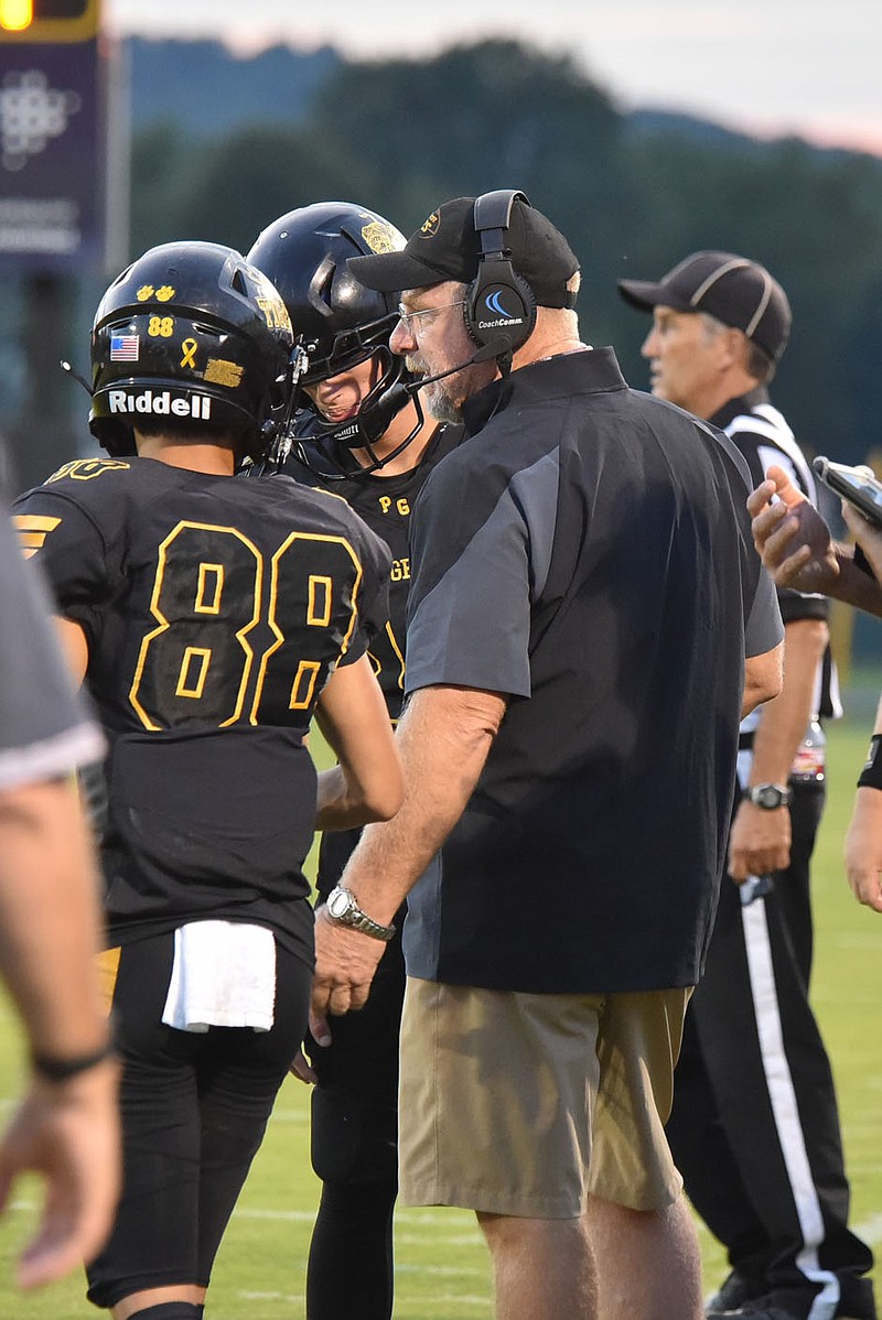 Coach Danny Abshier talks with his players during Prairie Grove's 35-33 victory over Pea Ridge last week. He'll go for career victory No. 202 at Prairie Grove tonight when the Tigers play at Stilwell, Okla.
(Photo submitted by Shelley Williams, Prairie Grove High School).