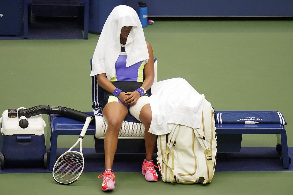 Naomi Osaka, of Japan, takes a break between sets against Victoria Azarenka, of Belarus, during the women's singles final of the US Open tennis championships, Saturday, Sept. 12, 2020, in New York. (AP Photo/Frank Franklin II)