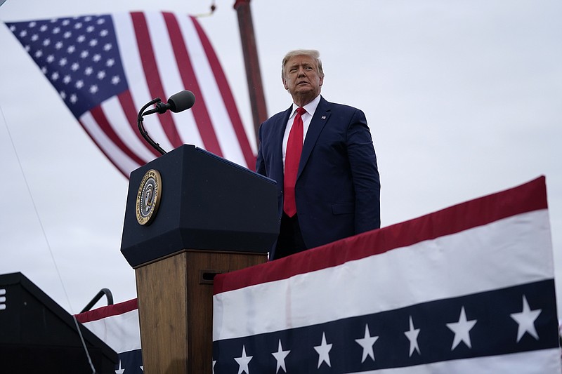 FILE - In this Sept. 10, 2020, file photo President Donald Trump arrives for a campaign rally at MBS International Airport in Freeland, Mich. Pushing for new roads to reelection, Trump will go on offense this weekend in Nevada, a state that hasn’t supported a Republican presidential candidate since 2004. (AP Photo/Evan Vucci, File)