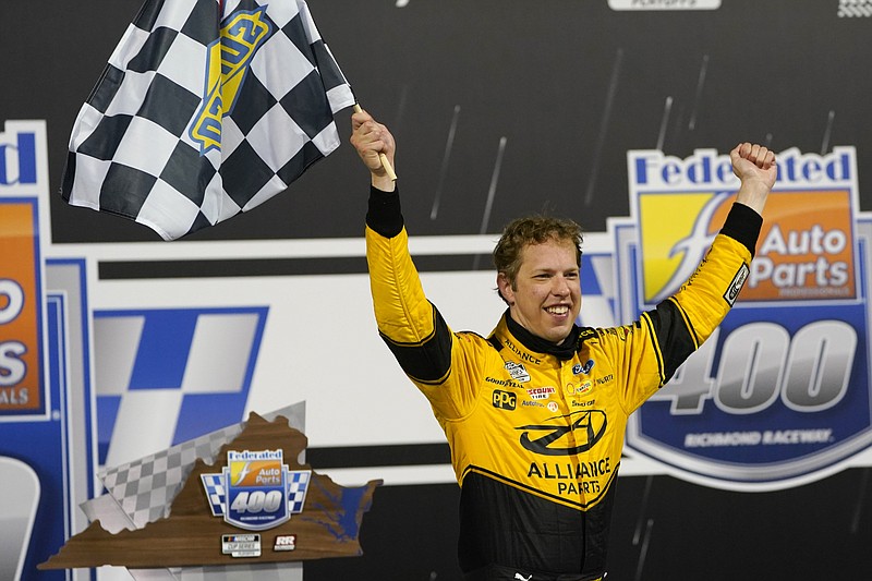 Brad Keselowski (2) celebrates in Victory Lane after winning a NASCAR Cup Series auto race Saturday, Sept. 12, 2020, in Richmond, Va. (AP Photo/Steve Helber)