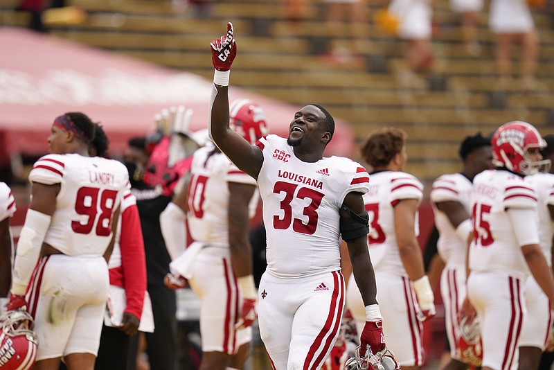 Louisiana-Lafayette linebacker Tyler Guidry celebrates on the sideline during the second half of an NCAA college football game against Iowa State, Saturday, Sept. 12, 2020, in Ames, Iowa. Louisiana-Lafayette won 31-14. (AP Photo/Charlie Neibergall)