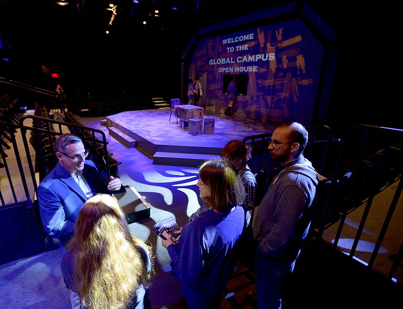 NWA Democrat-Gazette/ANDY SHUPE
Michael Riha (left), department chair for the University of Arkansas Department of Theatre, speaks Thursday, April 26, 2018, to a group of visitors during a tour of the renovated black box theater in the University of Arkansas Global Campus building on the Fayetteville square. Improvements to the building were also made in support of the university's online education program which serves a growing percentage of the student population.